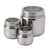 Set of three stainless steel food containers with lids on a white background